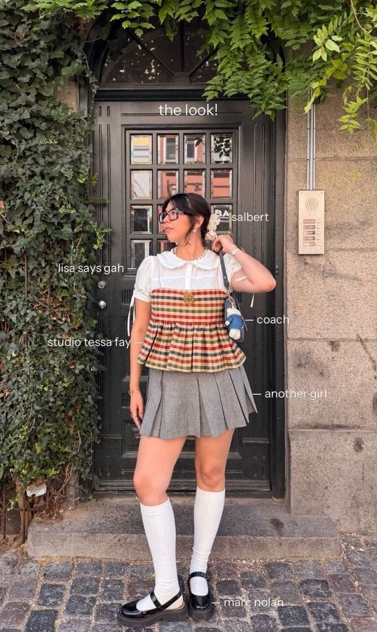 Sofia wearing a patterned mini dress outside
