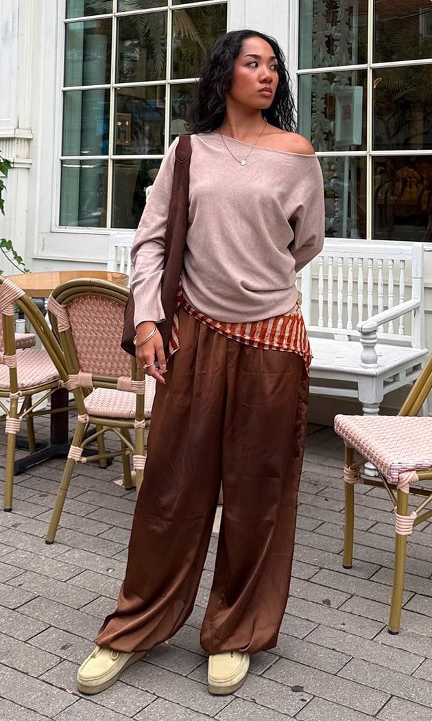 off the shoulder sweater and loose silk pants