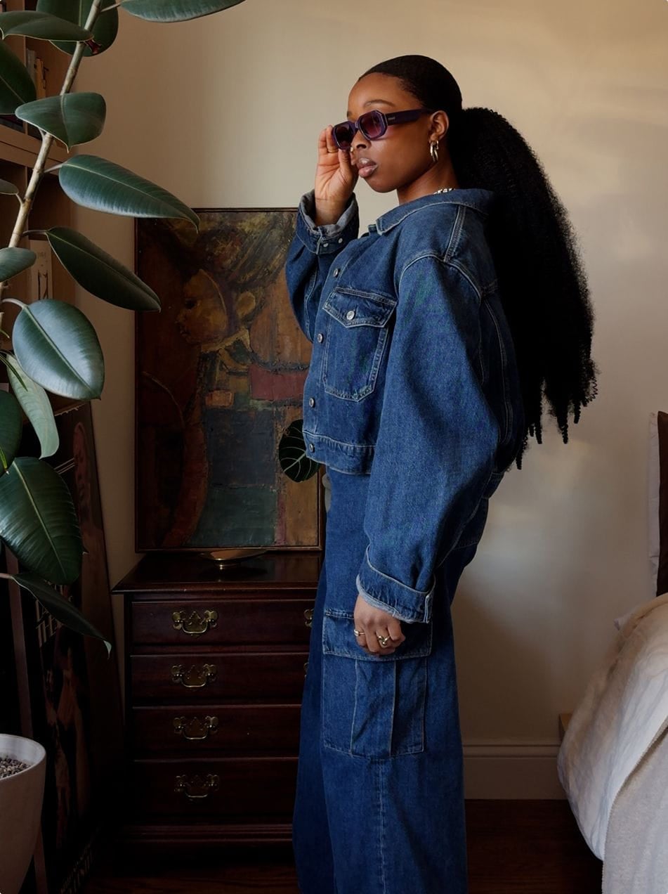 Dark wash cropped denim jacket with button closure and chest pockets