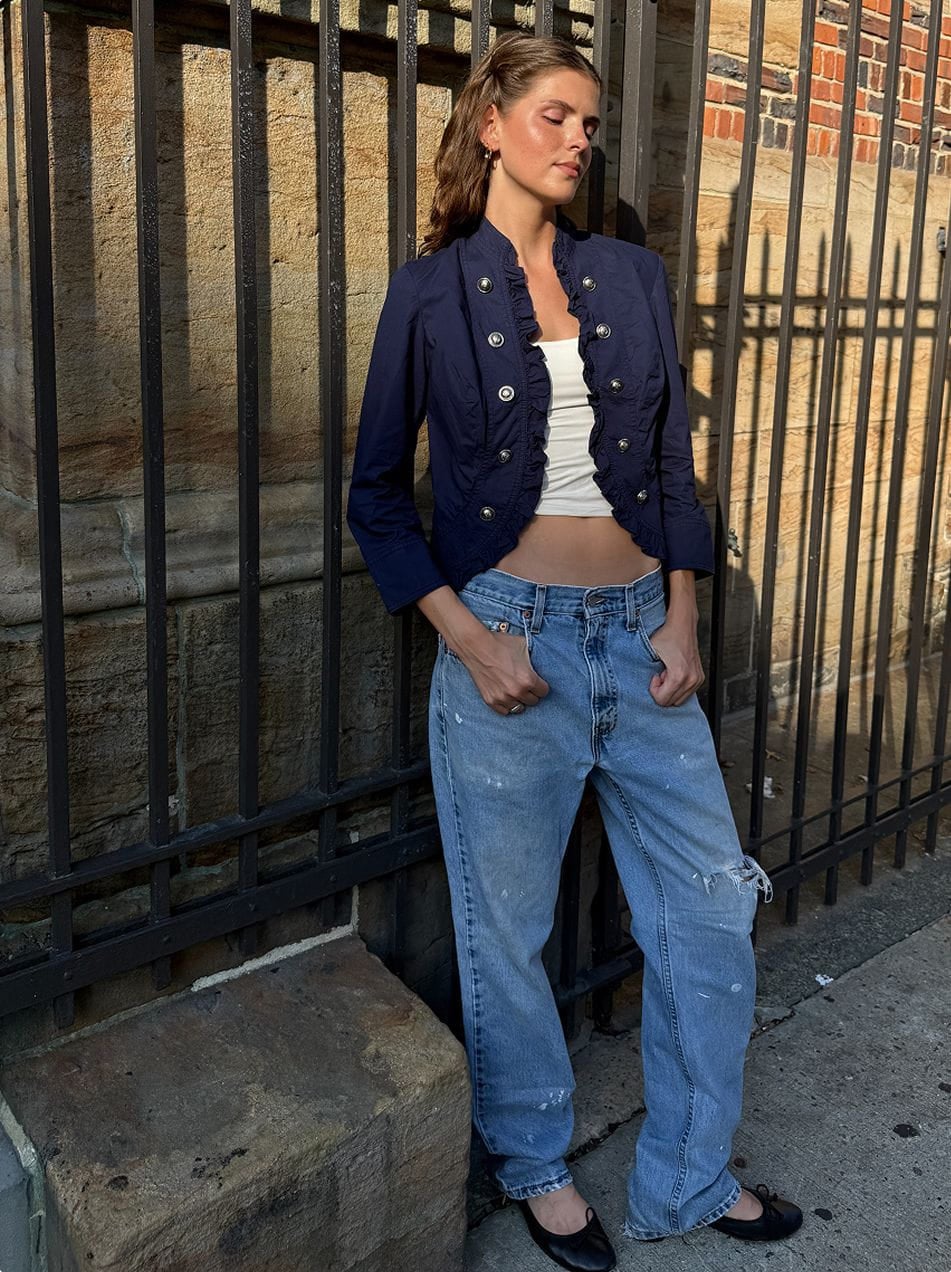 Navy blue military-style cropped jacket with large silver buttons